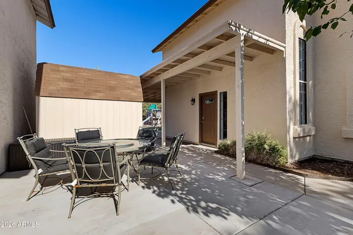 Covered patio designed for relaxing evenings and weekend gatherings.