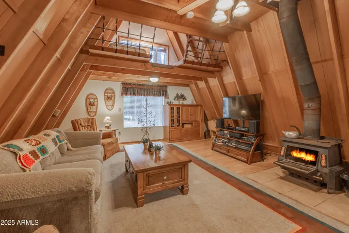 Original A-Frame with wood burning stove and sleeping loft.