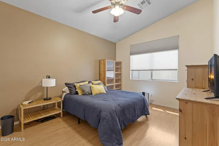 Large bedroom with vaulted ceilings and two closets