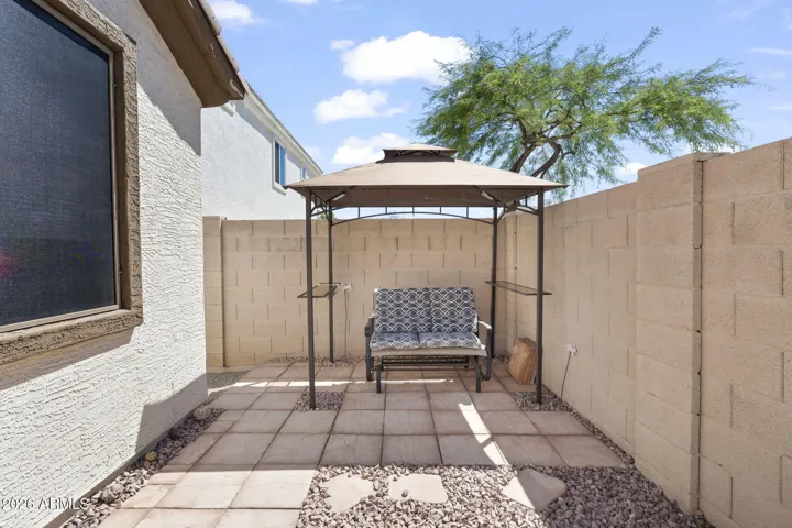 New desert river rock really decorates this backyard space