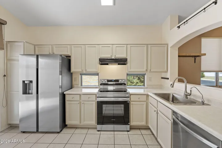 Beautiful brand new appliances including the countertop microwave all for the new buyer, garbage disposal, sink, faucet and ceiling LED light