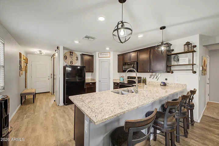 Enjoy plenty of cabinet storage, expansive countertop space, and a large walk-in pantry perfect for all your kitchen gadgets and essentials.