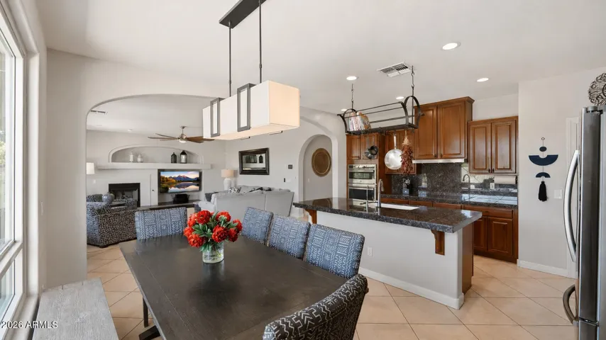 Eat-in kitchen with abundant cabinet and counter space, a walk-in pantry, and enough room for a full-size dining table.