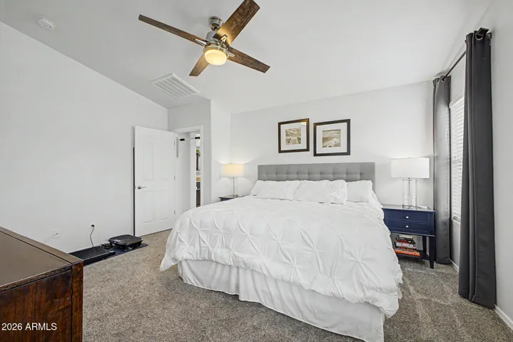 Primary bedroom w/ vaulted ceilings