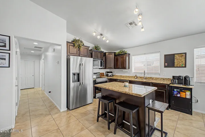 open kitchen w/ lots of light, brand new refrigerator included