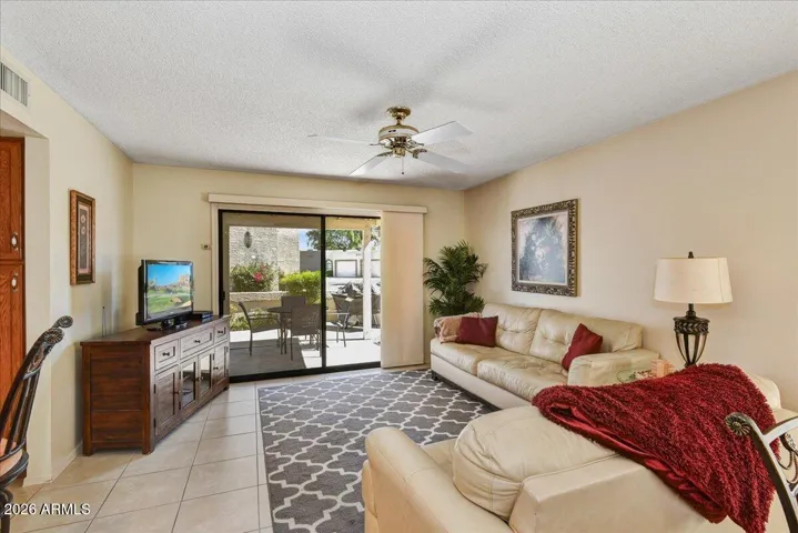 An alternate angle of the spacious family room highlights the generous layout, perfect for hosting guests or relaxing with family.