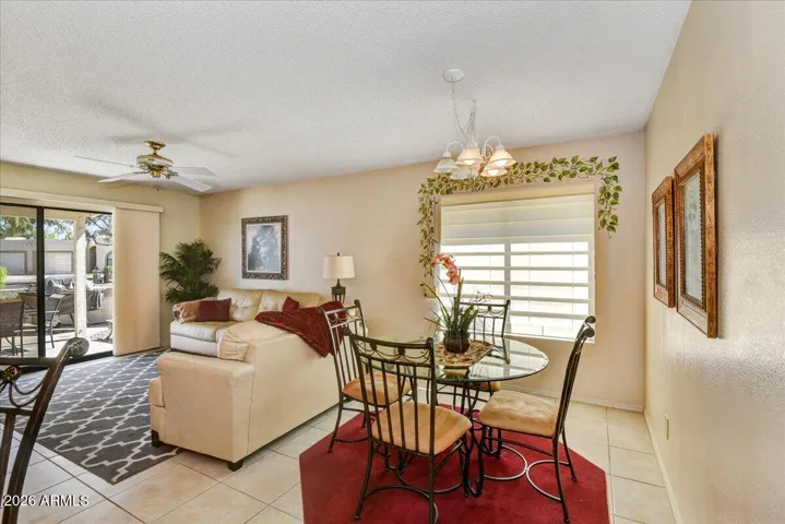 A bright, open-concept great room that comfortably connects a cozy living space with an informal dining area