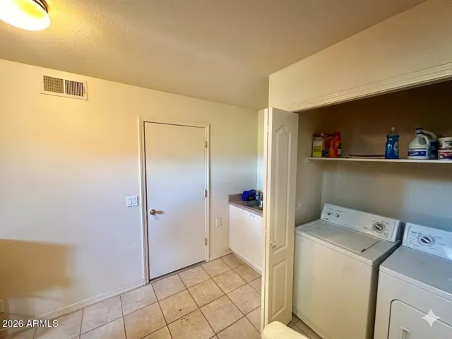 Downstairs: laundry, W & D; a sink next to it.