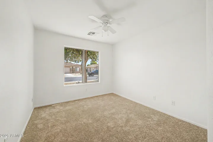 Bedroom 3 facing street. Brand new carpet.