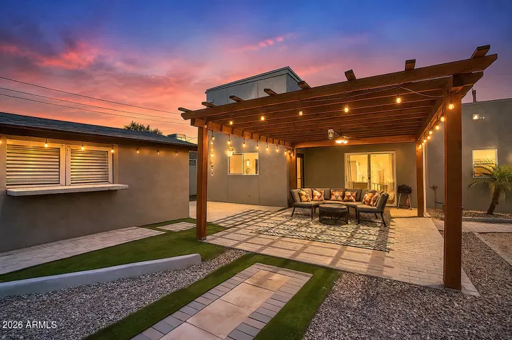 Evenings in the rear yard are full of ambiance with the natural warm glow of the party lights