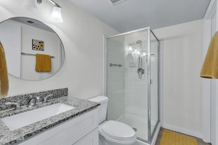 Downstairs bathroom connects to hallway and bedroom