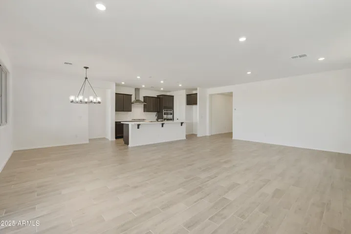 HOME COMES WITH GOURMET KITCHEN WITH BUILT-IN APPLIANCES, QUARTZ COUNTERS, DESIGNER BACKSPLASH AND HOOD.