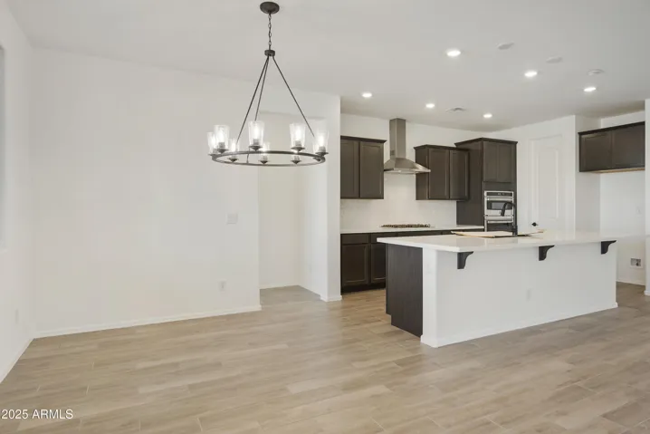 HOME COMES WITH GOURMET KITCHEN WITH BUILT-IN APPLIANCES, QUARTZ COUNTERS, DESIGNER BACKSPLASH AND HOOD.