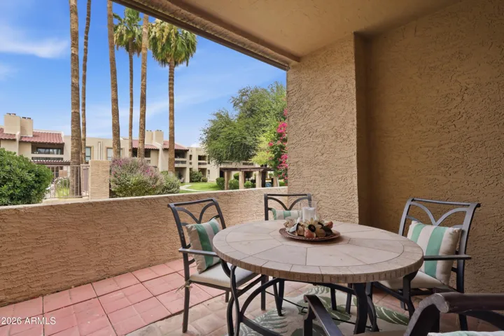 Back patio faces lush landscaping and is steps away from the community pool.