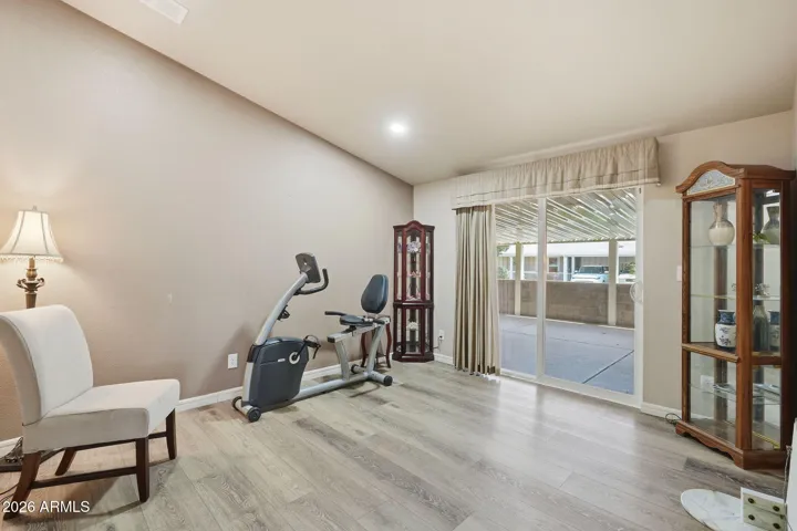 Use this room for a TV room, hobby room or an office. The sliding glass door leads to the covered patio.