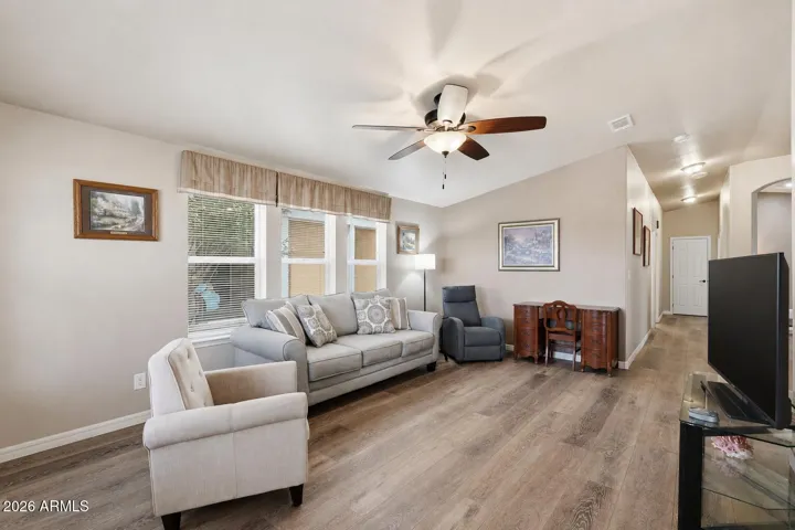 Large living room with lots of windows.