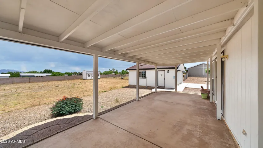 Back patio with view towards garage