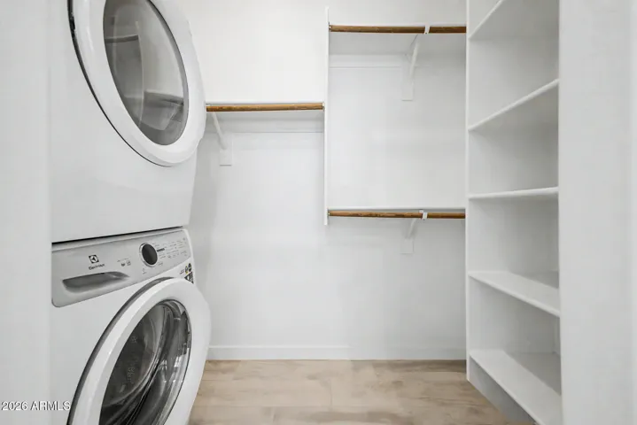 Next Gen closet with stacked laundry & shelves