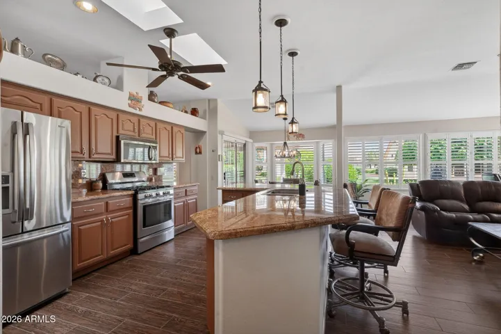 A large island separates the kitchen and family room but offers an open feel.