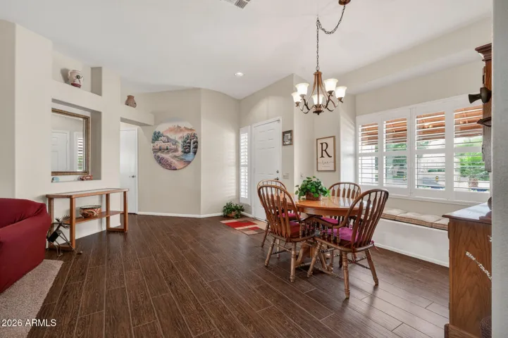 The dining space looks out over the grassy front yard.
