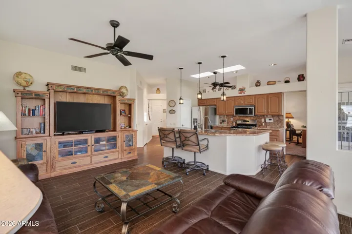 Notice the breakfast bar at the kitchen island...perfect for a casual meal.
