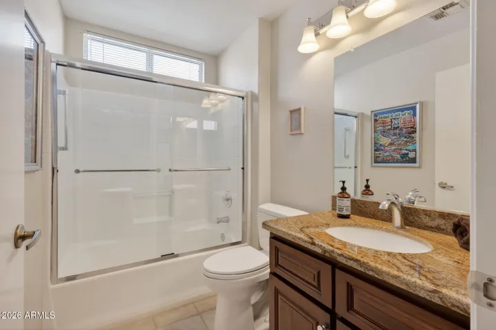 A raised vanity, inlaid sink, new faucet, Toto toilet and new lighting will impress your guests.