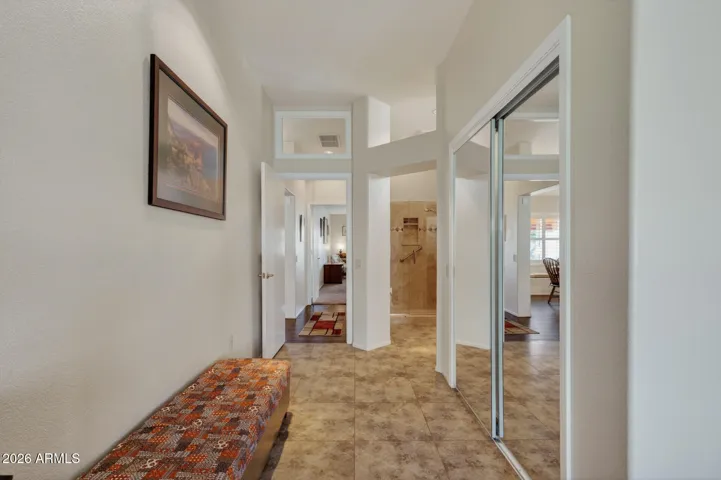 This is the entry into the owner's suite with the walk-in closet behind the mirrored door.