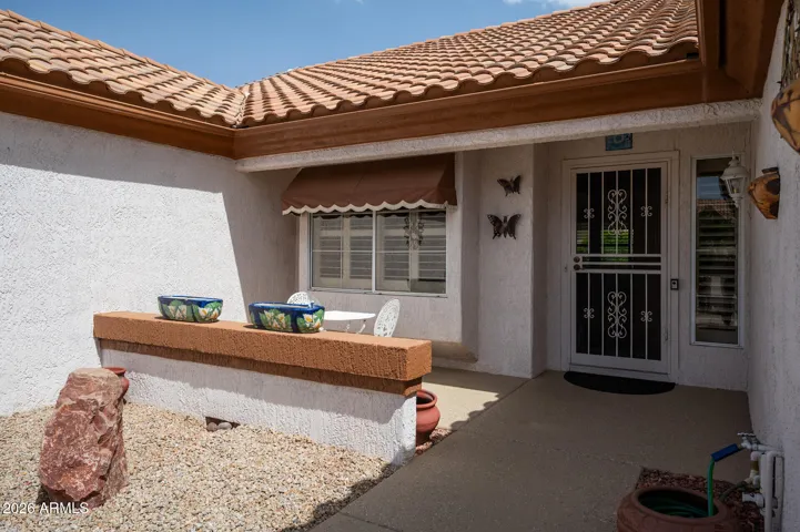 Relax with your favorite beverage while you watch the neighbors walk past.