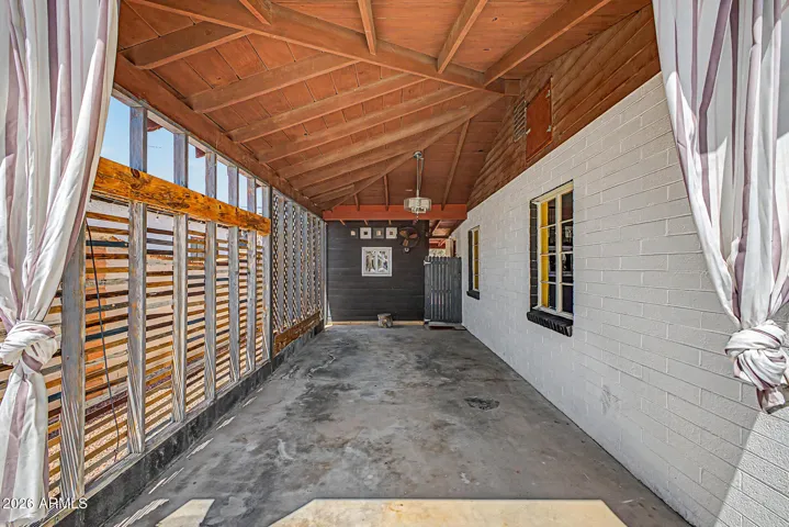 Carport w/ high ceiling & fan