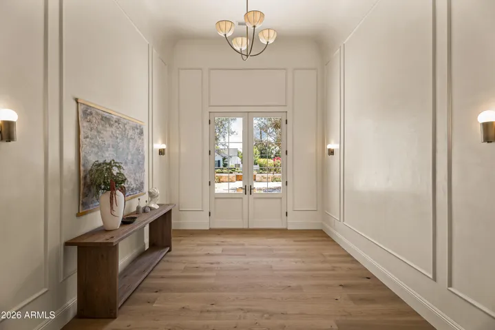 Foyer with Custom Molding, Roman Clay Paint, and Designer Lighting
