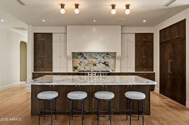 Chef's Kitchen with ILVE range, Marble Counters, Breakfast Nook, and Hidden Prep Kitchen