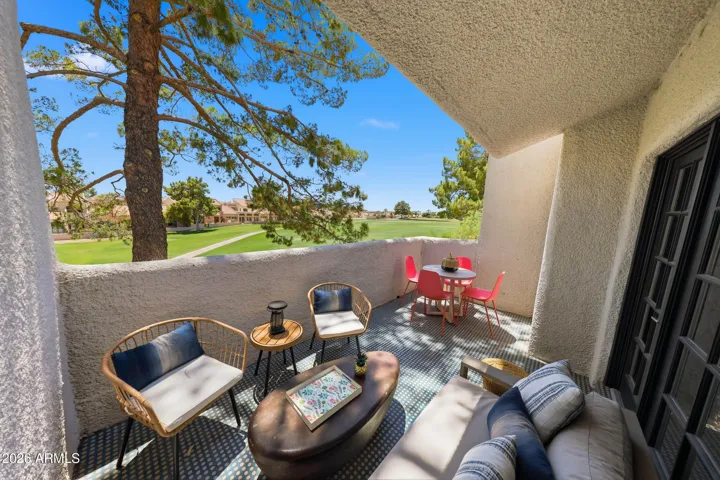 Back patio with Moroccan tile, overlooks the golfcourse under the shade of the pine trees.