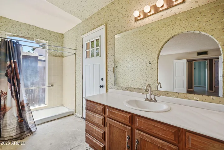 Primary bath. Exterior door has been replaced