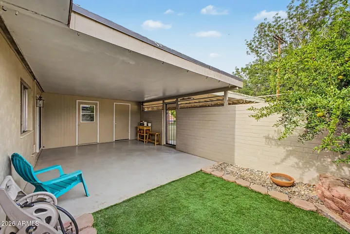 wonderful yard with low maintenance turf, a pomegranate tree and huge covered patio