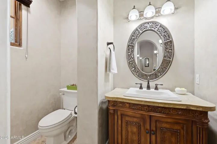 Convenient hallway powder room thoughtfully designed for guests.