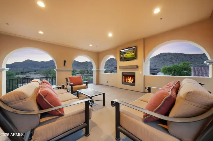 Expansive upstairs balcony offering panoramic mountain and neighborhood views.