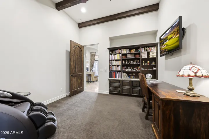 Bedroom four currently styled as a private office with flexible living potential.