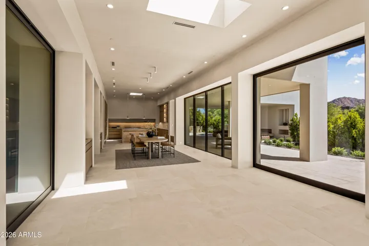 Open Concept Living + 10' Fleetwood Sliding Doors Opening to Mountain Views