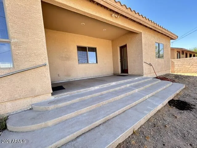 Patio for cool evening grilling Fountain Steps to Walled Yard