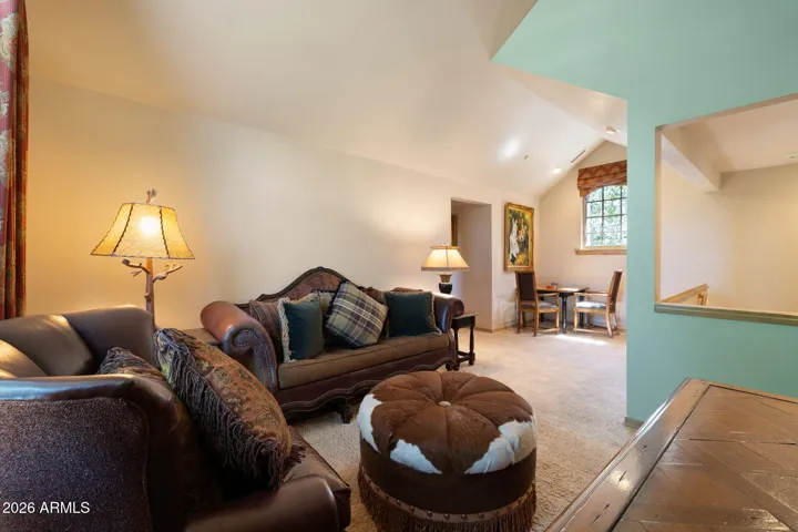 upstairs loft with large sitting area (this wall is not green it is white)