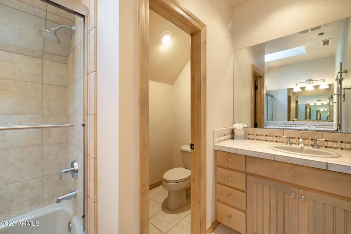 3rd bedroom bathroom with dual sinks