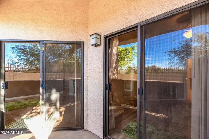 Exit to patio from main living area and primary bedroom