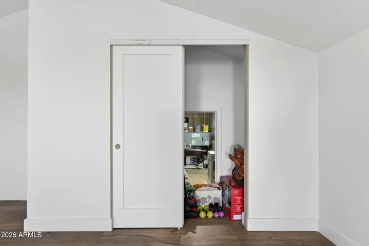 Loft closet with access to 265 sqft engineered storage