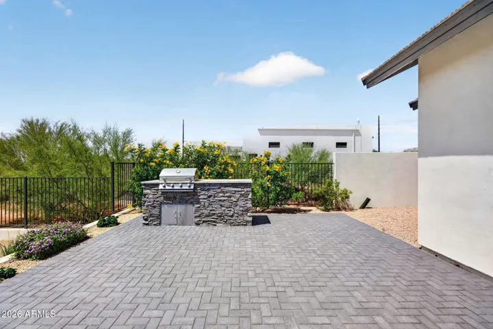 Outdoor cooking area off covered patio