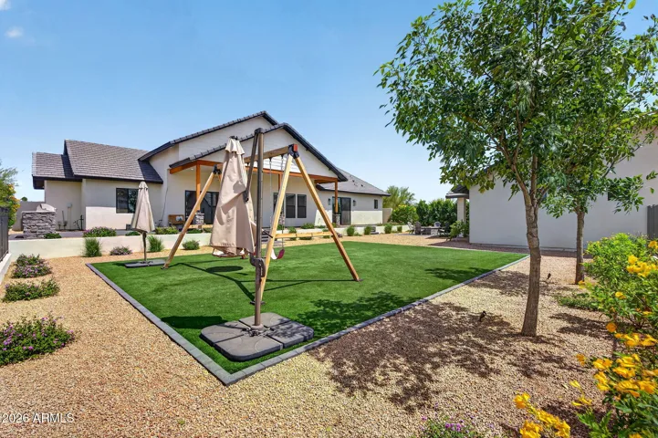 Backyard with turf and landscaping