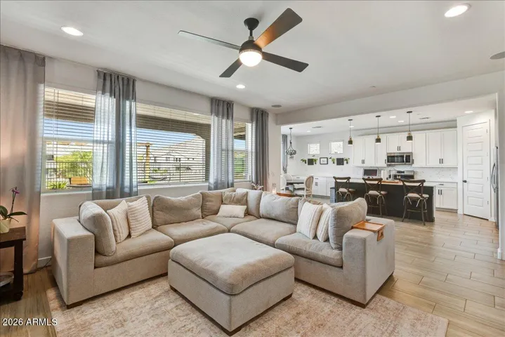 This vantage point showcases the home’s highly desirable great room layout. The effortless transition between the living zone, casual dining area, and the kitchen island makes this the perfect central hub for hosting family and friends.