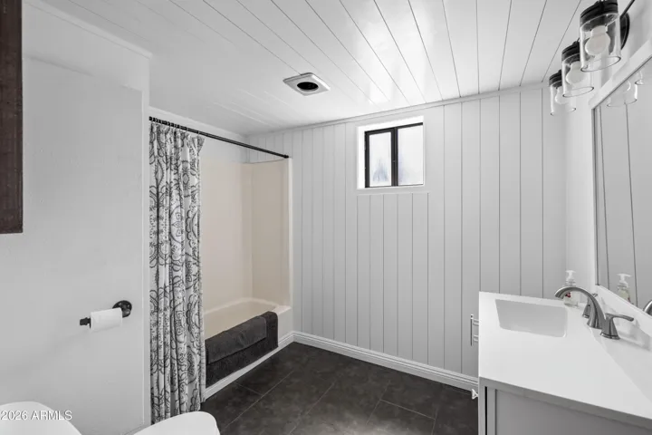 Clean and bright bathroom with a simple layout.