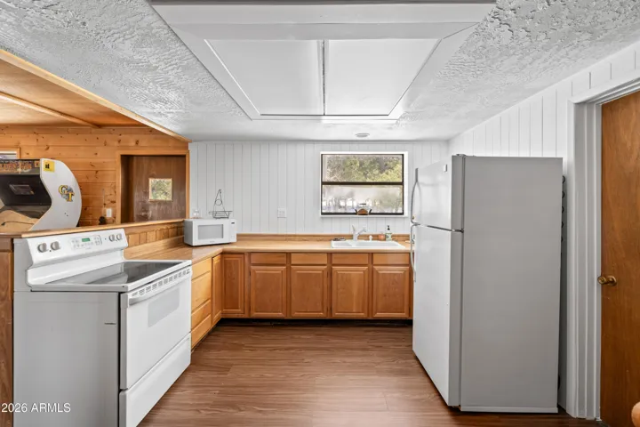 Bright kitchen with plenty of cabinet space and natural light