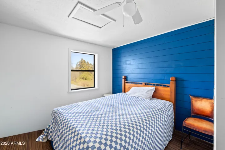 Bright bedroom with a bold accent wall.