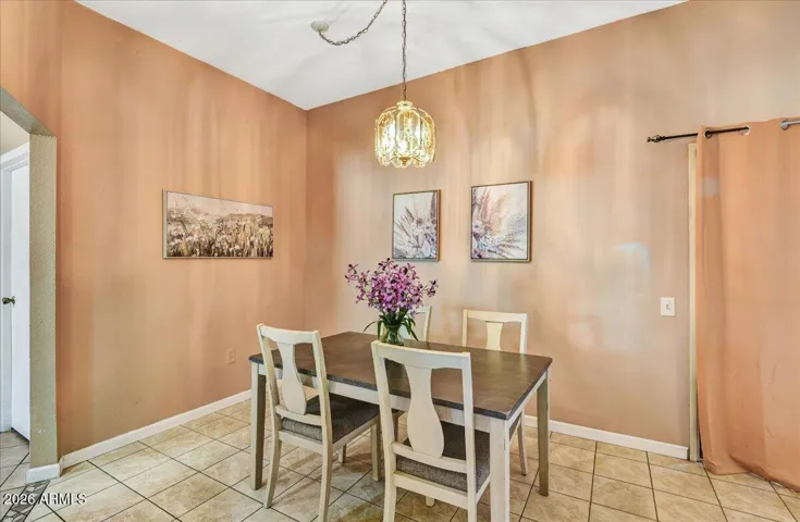 Elegant formal dining area adjacent to the main living space, ideal for all your hosting